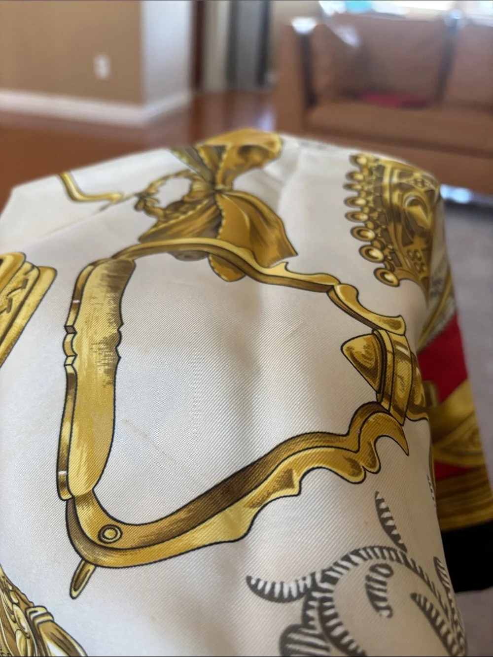 Hermès silk scarf in gold, red and black ornate print